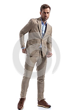 Businessman with cool vibe posing with one hand in pocket