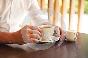 Young businessman with cup of coffee