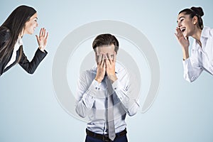 Young businessman dealing with bullying at workplace on background. Attractive european businessmen portrait