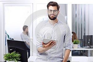 Young businessman with digital tablet