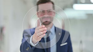 Young Businessman doing Hand Shake Gesture