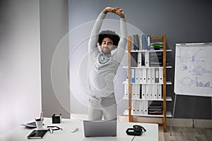 Young Businessman Doing Stretching Exercise