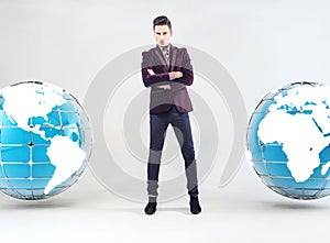 Young businessman and Earth globe