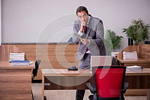 Young businessman employee in bullying concept in the office
