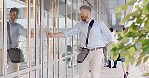 Young businessman entering business center