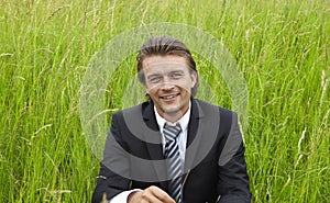 Young businessman in the fields