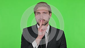 Young Businessman with Finger on Lips, Silence Green Screen