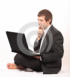 Young businessman in front of a laptop