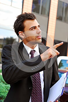 Young businessman in the front of office