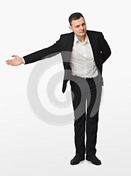 Young businessman gesturing welcome isolated