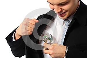 Young businessman with glass globe in hand