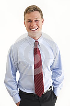 Young businessman with hands in pockets