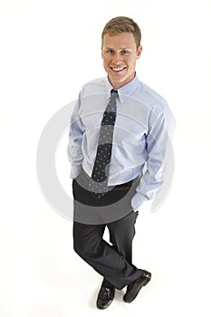 Young businessman with hands in pockets