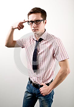 Young businessman having idea and pointing with finger