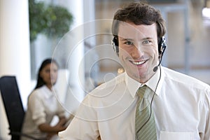 Young businessman with headset