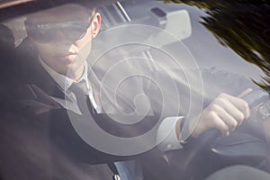 Young businessman in his car