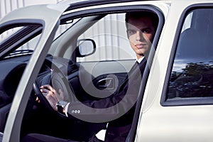 Young businessman in his car