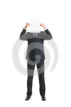 Young businessman holding a blank piece of paper