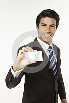 Young businessman holding business card. Conceptual image