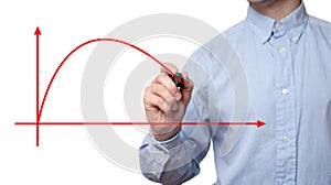 Young businessman holding marker and drawing on glass screen graphic