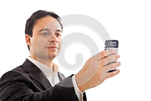 YOUNG BUSINESSMAN HOLDING MOBILE PHONE