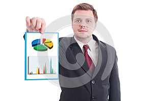 Young businessman holding paper with investment growth