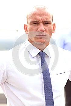 Young businessman holding tablet in hands outdoor