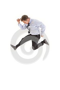 Young businessman jumping in the air