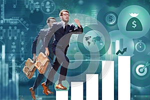 Young businessman jumping over steps of chart or graph