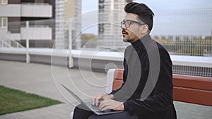 Young businessman long time working ablet computer and tired outdoor