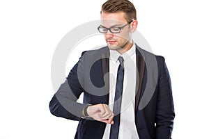 Young businessman look at his watches, isolated