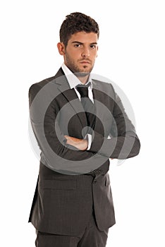 Young businessman looking serious arms crossed