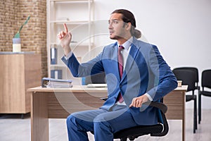 Young businessman making presentation during pandemic