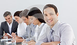 Young businessman in a meeting with his team