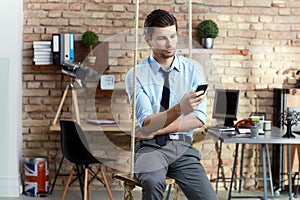 Young businessman with mobilephone