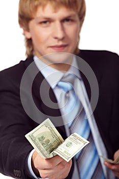Young businessman with money photo