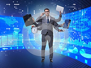 The young businessman in multitasking concept