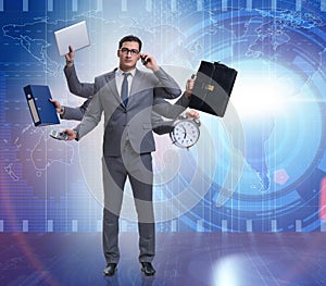 Young businessman in multitasking concept