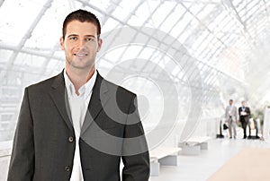 Young businessman in office lobby