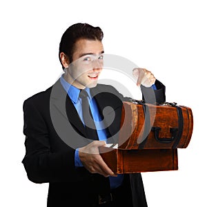 Young businessman opening the treasure box