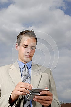 Young businessman with PDA