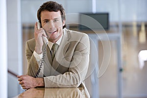 Young businessman on phone