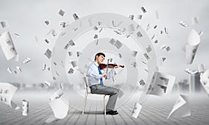 young businessman playing violin