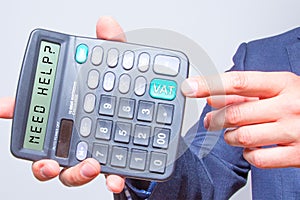 Young businessman pointing on calculator.Need Help? Vat Sign. Ta