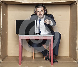 Young businessman pointing at you, office situation,