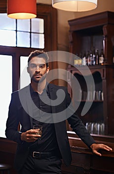 Young Businessman, portrait and alcohol for break in hotel and drink to relax on corporate trip. Entrepreneur, pub and