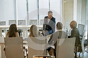 Young businessman presenting results to his coleagues in the office