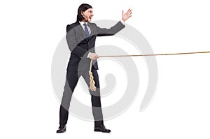 Young businessman pulling rope isolated