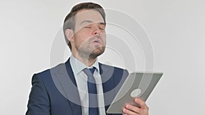 Young Businessman Reacting to Loss on Tablet on White Background