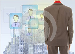 Young businessman with rendered city skyline